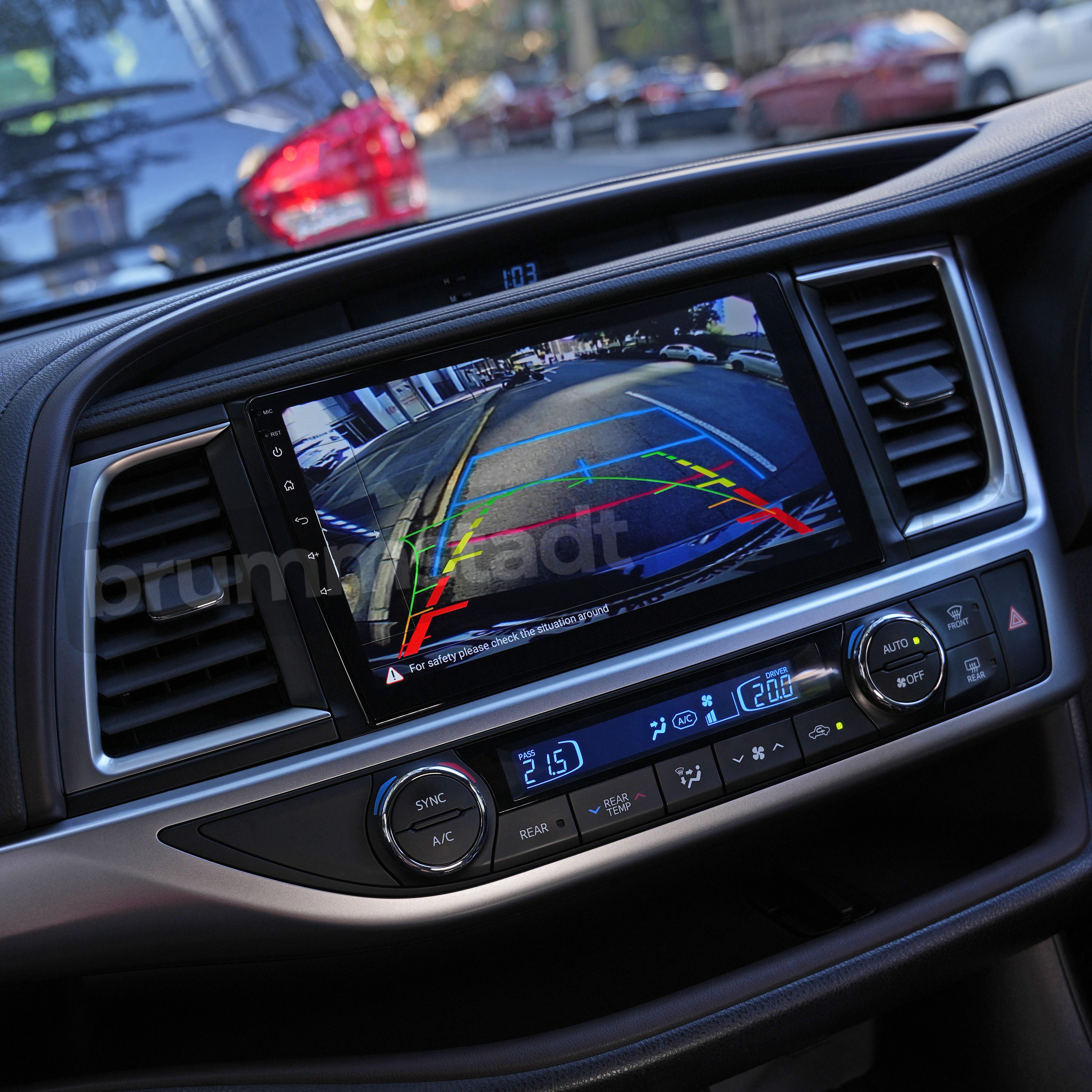 Brummstadt, Toyota Kluger 2014-2019, Brummstadt head unit, Apple CarPlay navigation, Android Auto interface, rear camera display, parking assist lines, glossy black bezel, touchscreen, dual-zone climate control knobs, central air vents, dashboard upgrade, smartphone integration, Bluetooth audio, steering wheel controls, vehicle electronics enhancement.