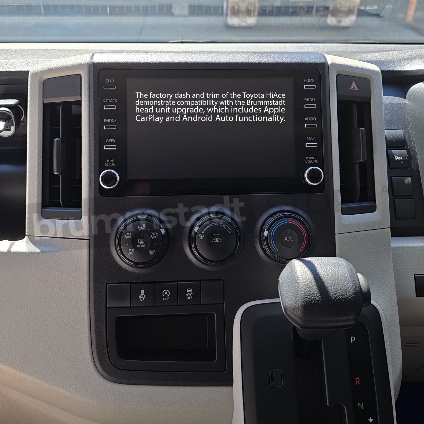 Brummstadt, Toyota HiAce 2019-2025, Brummstadt head unit, Apple CarPlay, Android Auto, factory dashboard, touchscreen display, climate control knobs, infotainment system upgrade, wireless connectivity, wired connection, Toyota HiAce interior, user interface, audio controls, vehicle electronics, modern dashboard design.